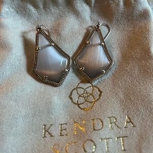 Kendra Scott drop earrings.